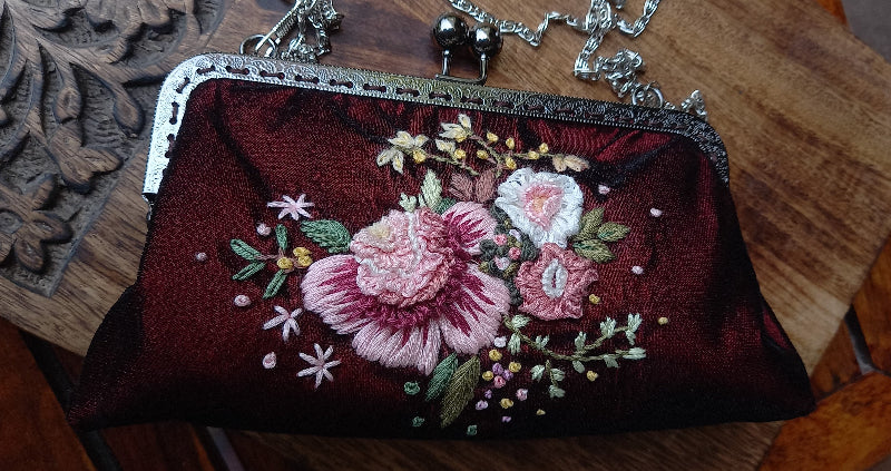 Velvet handcrafted purse with hand embroidered serene pastel peach flowers