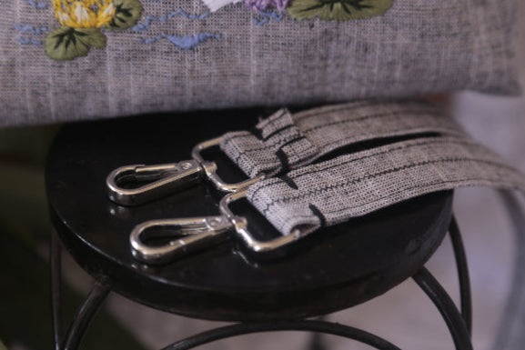 Hand embroidered swan and flowers on a linen purse, crafted with care, featuring a soft cotton lining.