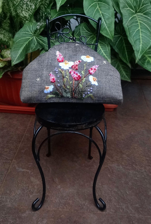 Handcrafted brownish khadi linen purse embellished with hand embroidery with pretty delicate white and pink wildflowers